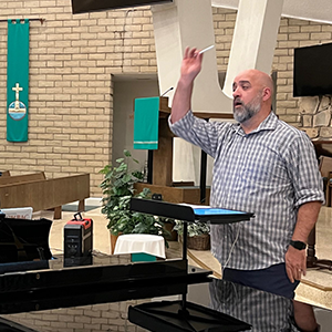 Brian Dehn conducts a rehearsal of Hunchback of Notre Dame